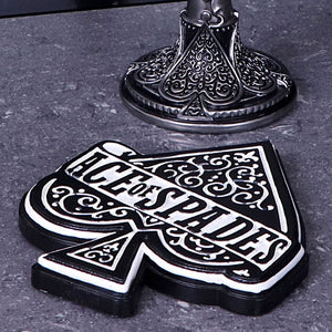 Ace of Spades emblem coaster in black & white on a grey marble table next to a metal goblet